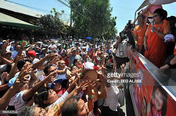 Philippine former first lady Imelda Marcos speaks to residents during a campaign sortie in the town of Batac, Ilocos norte province north of Manila,...