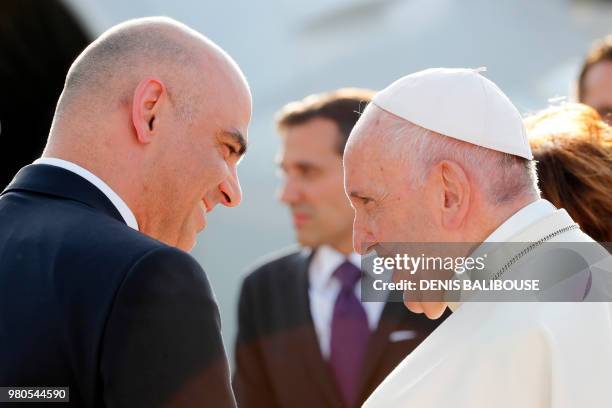 Pope Francis speaks with with Swiss President Alain Berset before leaving at Cointrin airport in Geneva, on June 21 2018 after a one-day visit at the...