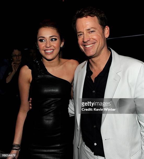Actors Miley Cyrus and Greg Kinnear pose at the afterparty for the premiere of Touchstone Pictures' "The Last Song" at The W Hotel on March 25, 2010...