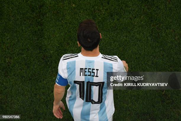 Argentina's forward Lionel Messi walks on the pitch during the Russia 2018 World Cup Group D football match between Argentina and Croatia at the...
