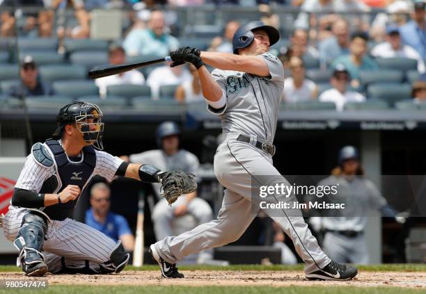 Kyle Seager of the Seattle Mariners follows through on a second inning two run home run against the New York Yankees at Yankee Stadium on June 21,...