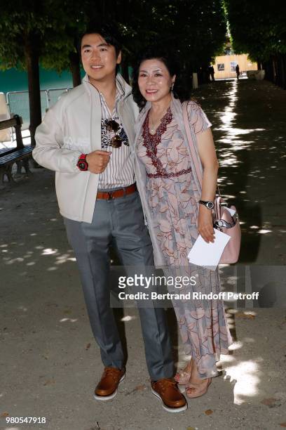 Pianist Lang Lang and his mother attend the Louis Vuitton Menswear Spring/Summer 2019 show as part of Paris Fashion Week on June 21, 2018 in Paris,...