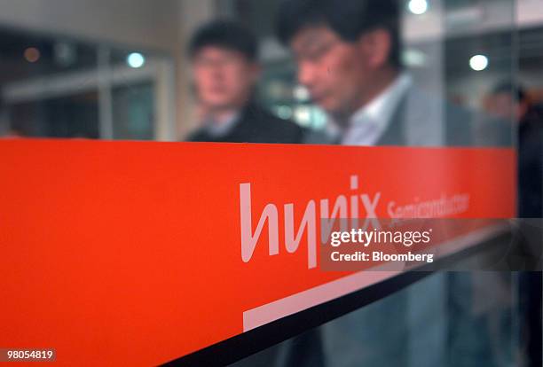 Shareholders exit the auditorium after the Hynix Semiconductor Inc. Annual general shareholders meeting at the company's plant in Icheon, South...