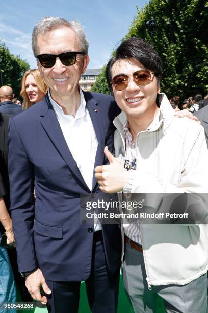 Owner of LVMH Luxury Group Bernard Arnault and Pianist Lang Lang attends the Louis Vuitton Menswear Spring/Summer 2019 show as part of Paris Fashion...