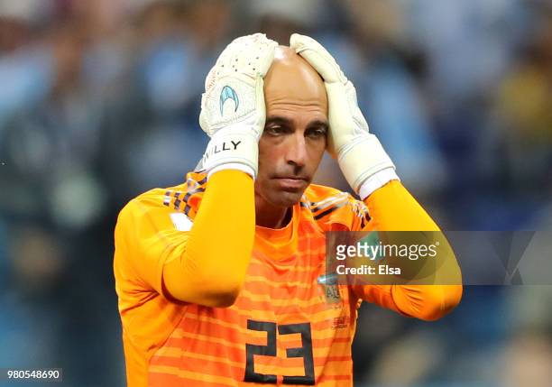 Wilfredo Caballero of Argentina holds his head in his hands as he stands dejected after his mistake leads to a Croatia goal scored by Ante Rebic...