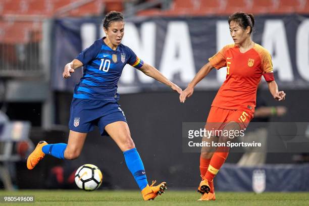 United States midfielder Carli Lloyd battles with China PR defender Wu Haiyan during an international friendly soccer match between the USA and China...