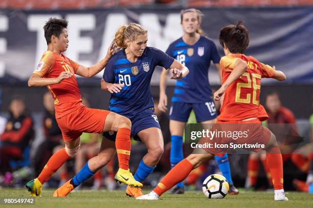 United States midfielder Allie Long battles with China PR forward Li Ying and China PR defender Wang Yan during an international friendly soccer...