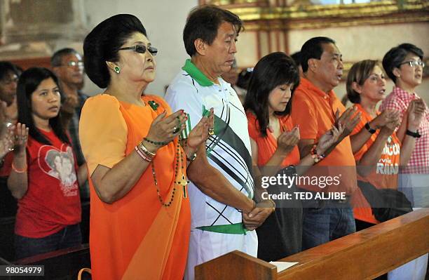 Philippines former first Lady Imelda Marcos attends mass at a church prior to a campaign sortie in the town of Paoay, Ilocos norte province north of...