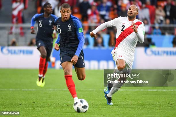 Kylian Mbappe of France and Alberto Rodriguez of Peru during the FIFA World Cup match Group C match between France and Peru at Ekaterinburg Arena on...