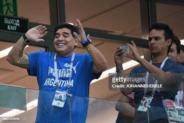 Argentina's football legend Diego Maradona gestures in the grandstand before the Russia 2018 World Cup Group D football match between Argentina and...