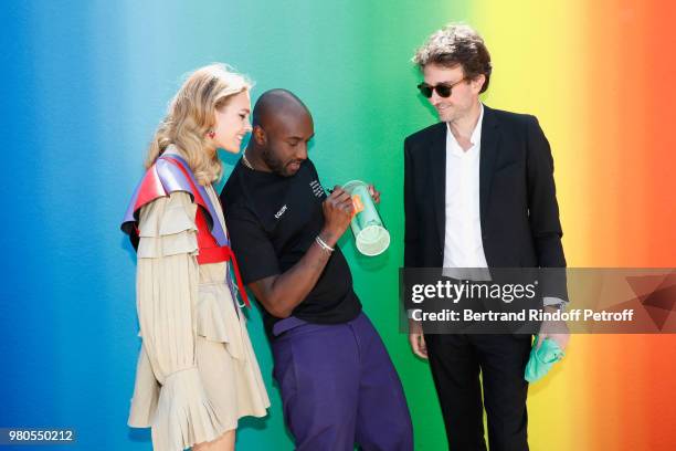 Stylist Virgil Abloh standing between Natalia Vodianova and General manager of Berluti Antoine Arnault pose after the Louis Vuitton Menswear...