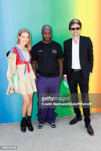 Stylist Virgil Abloh standing between Natalia Vodianova and General manager of Berluti Antoine Arnault pose after the Louis Vuitton Menswear...