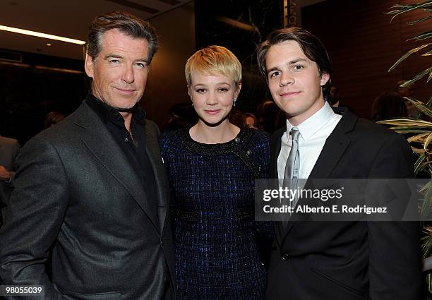 Actor Pierce Brosnan, actress Carey Mulligan and actor Johnny Simmons pose at the after party for the premiere of The Creative Coalition's 'The...