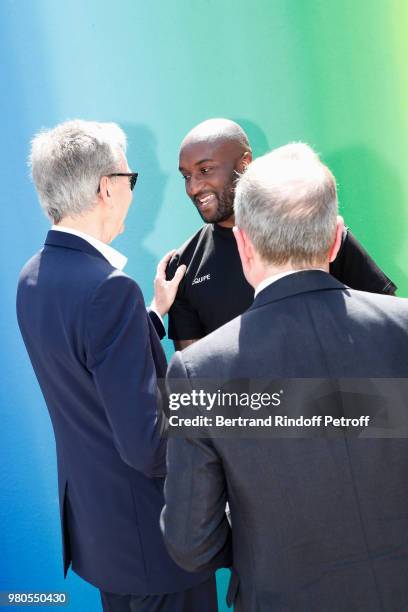 Owner of LVMH Luxury Group Bernard Arnault, Stylist Virgil Abloh and CEO of Louis Vuitton Michael Burke pose after the Louis Vuitton Menswear...