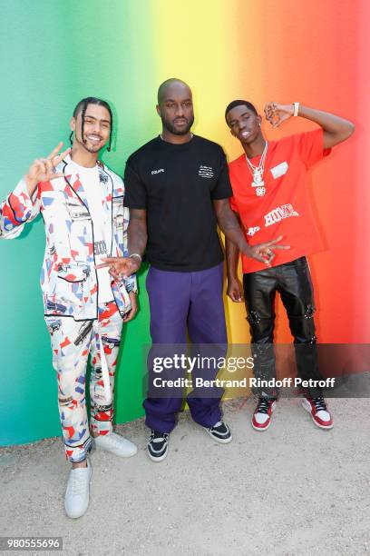 Stylist Virgil Abloh standing between Quincy Brown and his brother Christian Casey Combs pose after the Louis Vuitton Menswear Spring/Summer 2019...