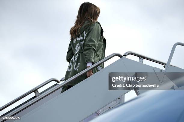 First lady Melania Trump boards an Air Force plane before traveling to Texas to visit facilities that house and care for children taken from their...