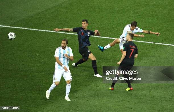 Paulo Dybala of Argentina shoots on target pastDejan Lovren and Ivan Rakitic during the 2018 FIFA World Cup Russia group D match between Argentina...