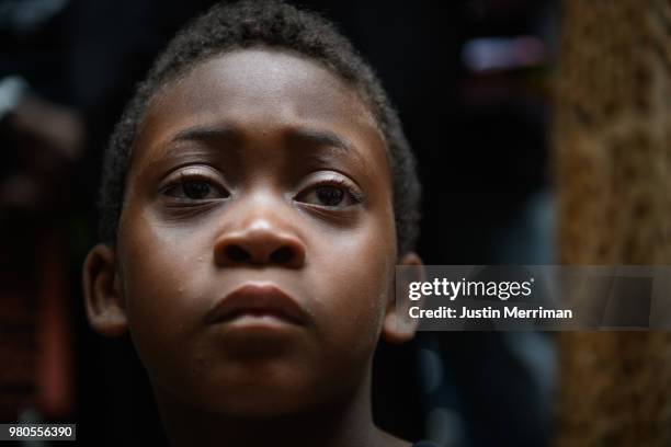 Jeremiah Rooke of the North Side, listens during a rally by more than 200 people protesting the fatal shooting of an unarmed black teen at the...