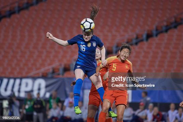 United States midfielder Rose Lavelle battles with China PR defender Wu Haiyan to head the ball during an international friendly soccer match between...