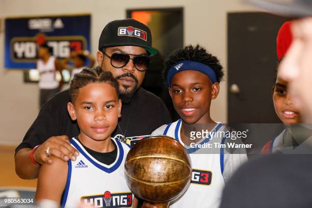 Rap Artist Ice Cube poses for a photograph with tournament champions during the Young3 Basketball Clinic and Tournament on June 21, 2018 in Houston,...