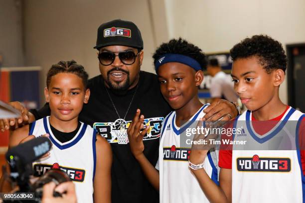 Rap Artist Ice Cube poses for a photograph with tournament champions during the Young3 Basketball Clinic and Tournament on June 21, 2018 in Houston,...