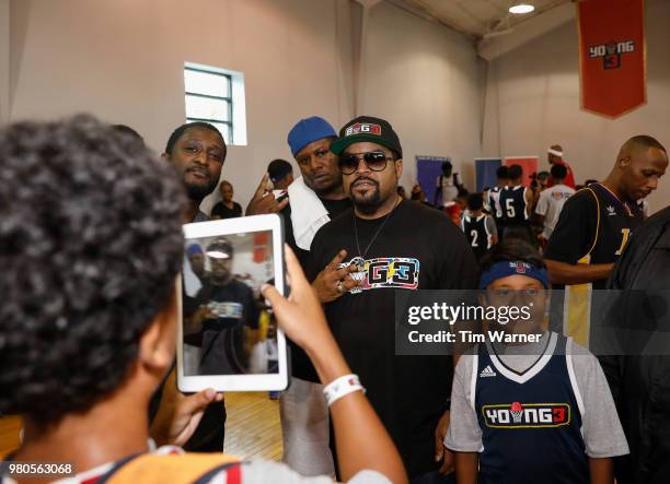 Rap Artist Ice Cube poses for photographs with participants during the Young3 Basketball Clinic and Tournament on June 21, 2018 in Houston, Texas.