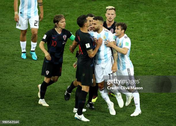 Dejan Lovren of Croatia confronts Nicolas Otamendi of Argentina, after Nicolas Otamendi of Argentina kicks a ball into Ivan Rakitic of Croatia during...