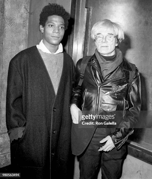 Jean-Michel Basquiat and Andy Warhol attend Gifts For The City Of New York Benefit on November 7, 1984 at Area Nightclub in New York City.