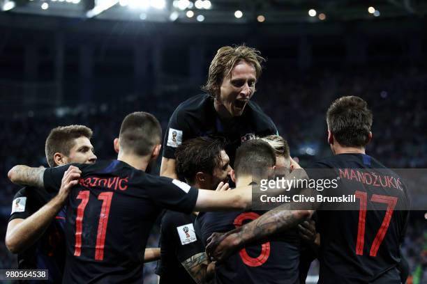 Ivan Rakitic of Croatia celebrates with teammates after scoring his team's third goal during the 2018 FIFA World Cup Russia group D match between...