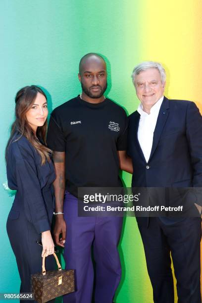 Stylist Virgil Abloh standing between Sidney Toledano and his daughter Julia pose after the Louis Vuitton Menswear Spring/Summer 2019 show as part of...