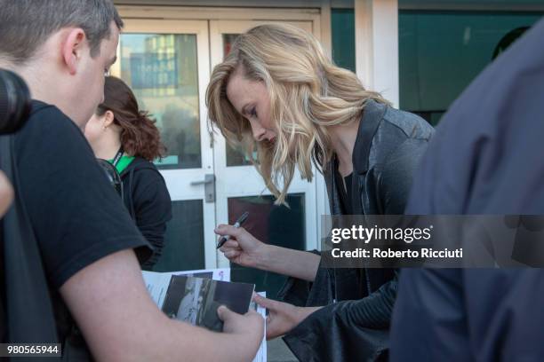 Scottish actress Shauna Macdonald signs autographs to fans during a photocall for the UK Premiere of 'White Chamber' during the 72nd Edinburgh...