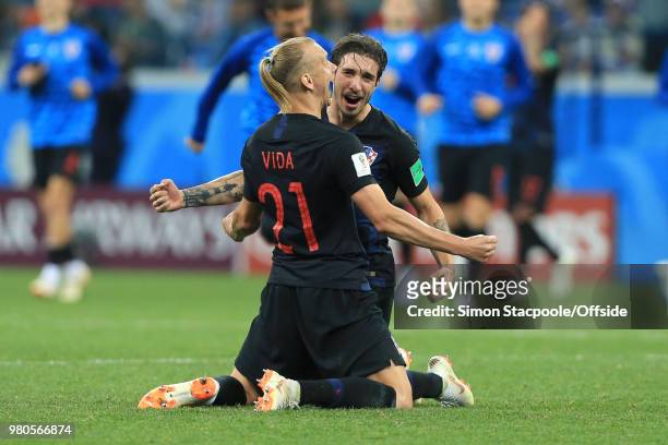 Domagoj Vida of Croatia and Sime Vrsaljko of Croatia celebrate their 3-0 win during the 2018 FIFA World Cup Russia Group D match between Argentina...