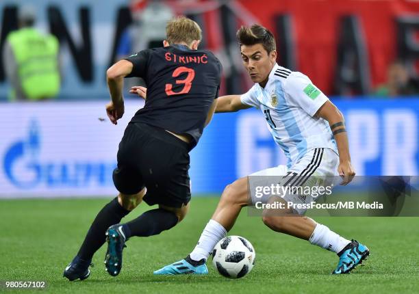 Ivan Strinic of Croatia competes with Paulo Dybala of Argentina during the 2018 FIFA World Cup Russia group D match between Argentina and Croatia at...