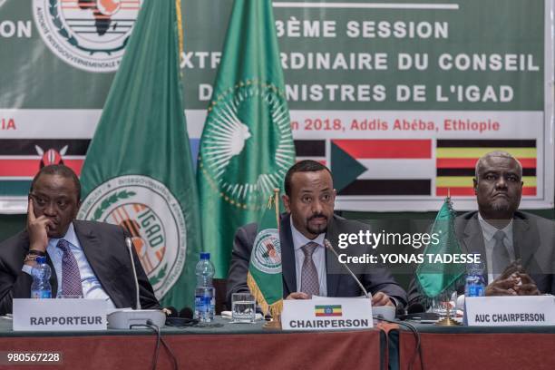 Ethiopia's Prime Minister Abiy Ahmed , African Union Commission Chairman Moussa Faki and Kenya's President Uhuru Kenyatta attend the 32nd...