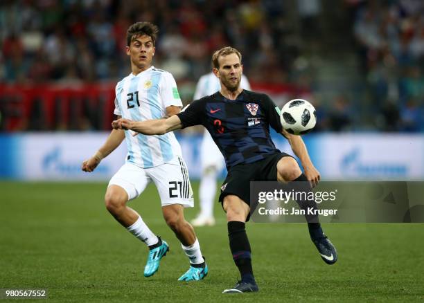 Ivan Strinic of Croatia is challenged by Paulo Dybala of Argentina during the 2018 FIFA World Cup Russia group D match between Argentina and Croatia...