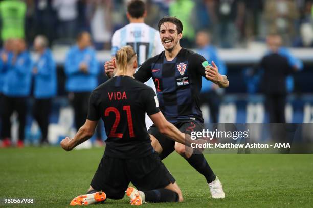 Domagoj Vida of Croatia celebrates with Sime Vrsaljko at the end of the 2018 FIFA World Cup Russia group D match between Argentina and Croatia at...