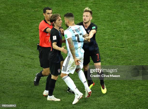 Nicolas Otamendi of Argentina argues with Luka Modric and Ivan Rakitic of Croatia during the 2018 FIFA World Cup Russia group D match between...