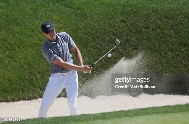 Jordan Spieth hits his third shot in for a eagle during the first round of the Travelers Championship at TPC River Highlands on June 21, 2018 in...