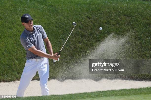 Jordan Spieth hits his third shot in for a eagle during the first round of the Travelers Championship at TPC River Highlands on June 21, 2018 in...