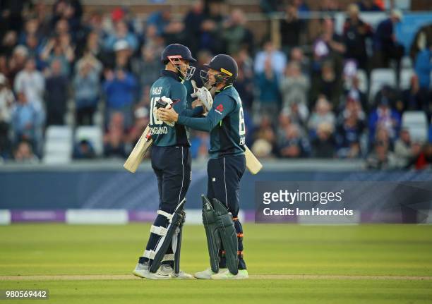 Jos Buttler and Alex Hales of England celebrate closing out the win during the 4th Royal London ODI at Emirates Durham ICG on June 21, 2018 in...