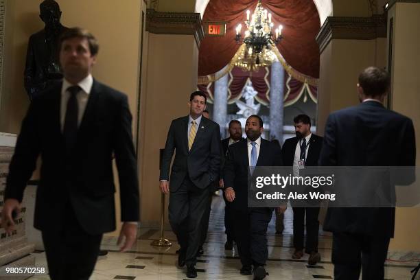 Speaker of the House Rep. Paul Ryan passes through a hallway at the U.S. Capitol prior to a vote June 21, 2018 in Washington, DC. Due to the defeat...