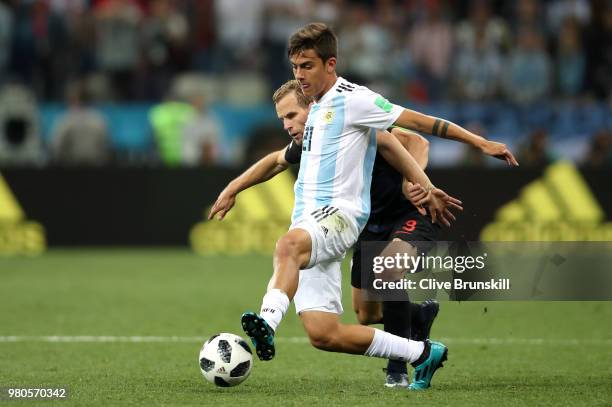 Paulo Dybala of Argentina holds off Andrej Kramaric of Croatia during the 2018 FIFA World Cup Russia group D match between Argentina and Croatia at...