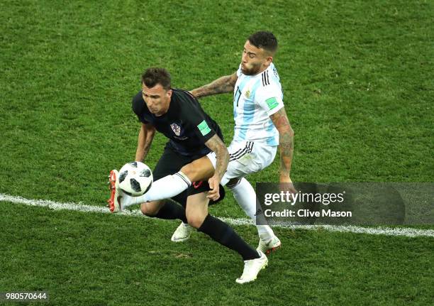 Mario Mandzukic of Croatia is tackled by Nicolas Otamendi of Argentina during the 2018 FIFA World Cup Russia group D match between Argentina and...