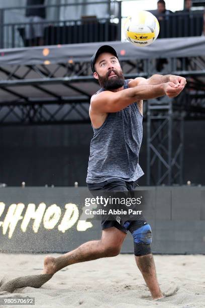 Riley McKibbin pumps the ball during qualifications of the AVP Seattle Open at Lake Sammamish State Park on June 21, 2018 in Issaquah, Washington.