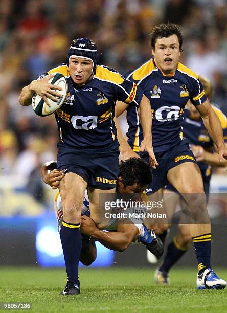 Matt Giteau of the Brumbies makes a line break during the round seven Super 14 match between the Brumbies and the Chiefs at Canberra Stadium on March...