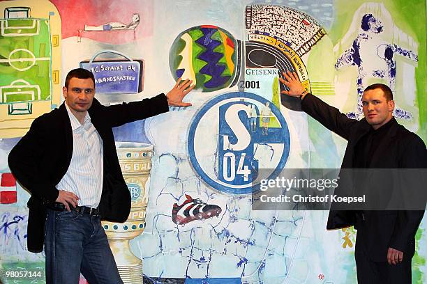 Vitali Klitschko of Ukraine poses with Albert Sosnowski of Poland gives an interview the Schalke museum before the press conference at Veltins Arena...