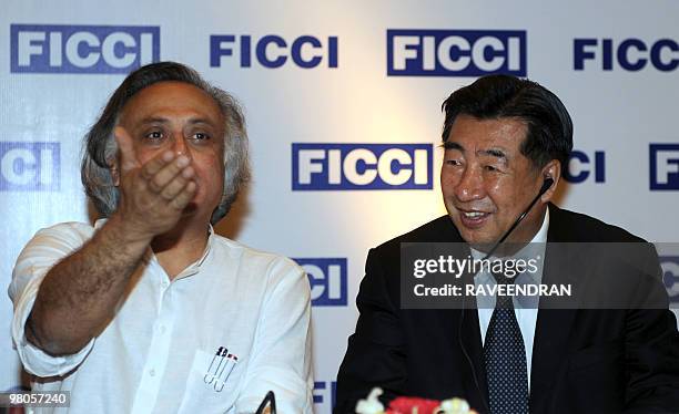 Vice-Premier of The People's Republic of China Hui Liangyu watches as Indian Minister of State for Environment and Forests Jairam Ramesh gestures...