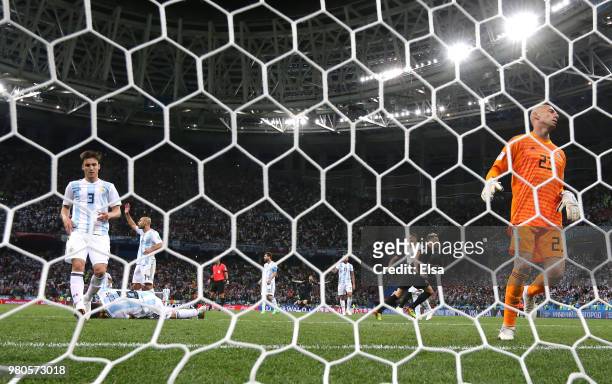 Ivan Rakitic of Croatia celebrates after scoring his team's third goal past Wilfredo Caballero of Argentina who looks dejected during the 2018 FIFA...