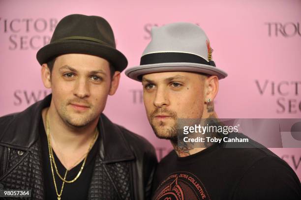 Joel Madden and Benji Madden pose for a picture at the 15th Anniversary of Victoria's Secret SWIM catalogue held at Trousdale on March 25, 2010 in...
