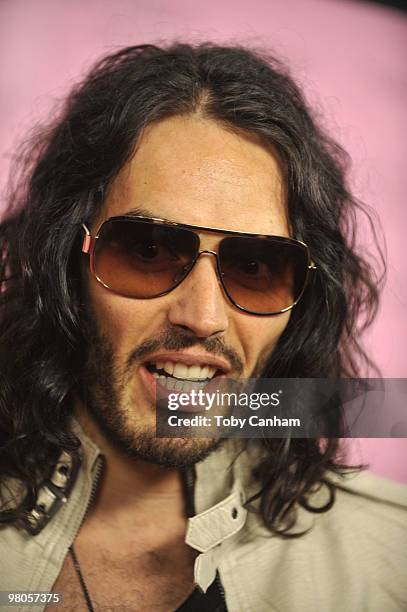 Russell Brand poses for a picture at the 15th Anniversary of Victoria's Secret SWIM catalogue held at Trousdale on March 25, 2010 in Los Angeles,...